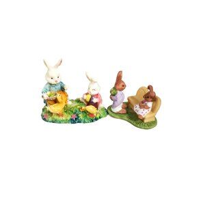 vintage set of 2 resin springtime pastel colors bunnies in a park.